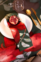 Grenade Green set of four Cotton Satin napkins with pomegranate and poinsettia print
